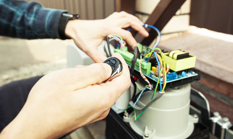 Technician Repairing Electric Gate